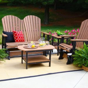 Glider poly furniture surrounded by plants.