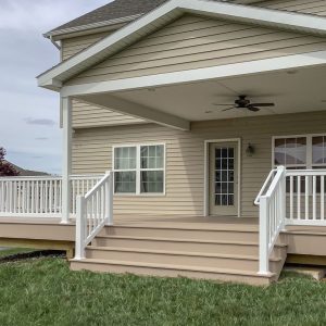 A beautiful house with white vinyl deck railings