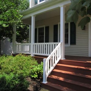 Baron white Railing on brownish red porch
