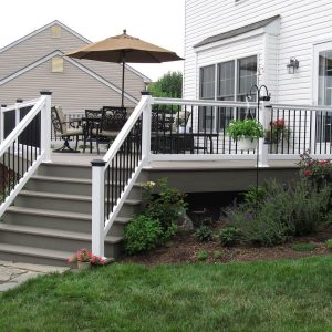 stairs with aluminum railing leading to finished vinyl deck