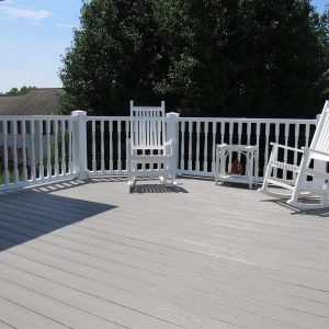 vinyl deck with white outdoor chairs and accents