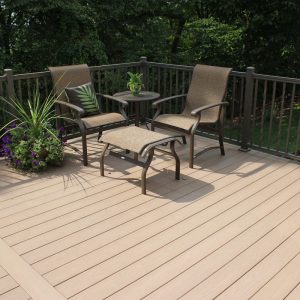 A vinyl deck with aluminum railing, patio furniture, and plants.